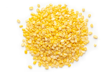 Macro Close up of Organic yellow Gram (Vigna radiata) or split yellow moong dal cleaned on a white...