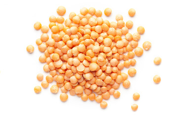 Macro Close-up of Organic masoor dal (Lens culinaris) or whole pink dal cleaned on a white background. Top view