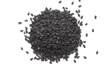 Macro Close up of Organic Black Sesame seeds(Sesamum indicum) or Black Til with the shell cleaned on a white background. Top view