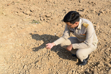 A Thai government official works outside the office, to explore the farming areas of the villagers.