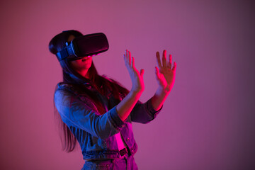 Close up woman portrait in vr glasses on isolated color background. Technology, virtual reality, gaming concept	
