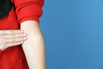 Adhesive plaster on arm after blood donation or blood testing