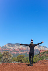 woman hiking the devil's bridge trail in sedona az mountain climber 