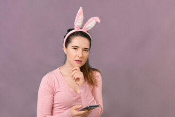 Obraz na płótnie Canvas Happy young woman wearing bunny ears.