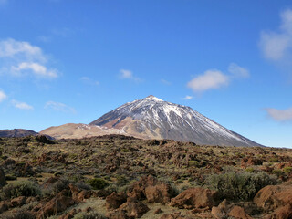 View of the volcano Mount Teide in Tenerife, Canary Islands, Spain, with snow in a sunny day