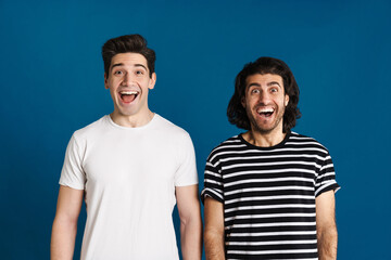 White excited two men exclaiming and looking at camera