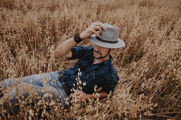 A man in the field, the rye is ripe for a crop of cereals.