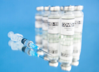 Covid-19 coronavirus vaccine on the blue background