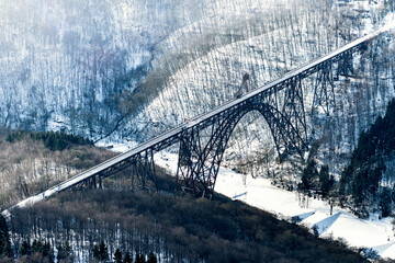 The Muengstener railroad Bridge in winter snow.