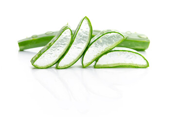 Macro or Close up fresh Aloe vera sliced four pieces placed side by side, with water drops on Aloe vera isolated on white background.