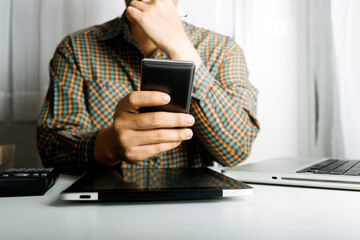 Searching Browsing Internet Data Information with blank search bar.businessman working with smart phone, tablet and laptop computer on desk in office. Networking Concept