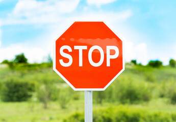 Single Stop Sign with a bang. Signature on the road