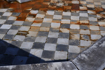 Old ground of a fountain with squares