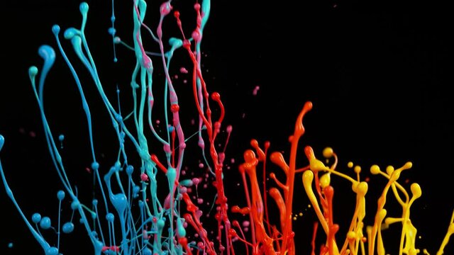 Super slow motion of dancing colors shapes isolated on black background. Filmed on high speed cinema camera, 1000fps.