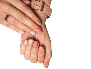 Beige red gel polish on short nails with marble design. Isolated hands with camouflage-colored...