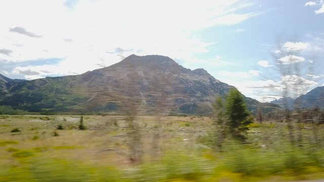 WATERTON, AB, CANADA - JULY 2019: Smooth & cinematic gimbal driving views of Waterton National Park Environment