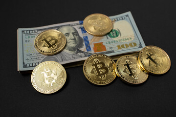 Bitcoin Crypto currency with US Dollar banknotes. Crypto Coins and 100 Dollar Bills. Digital currency on top of fiat money