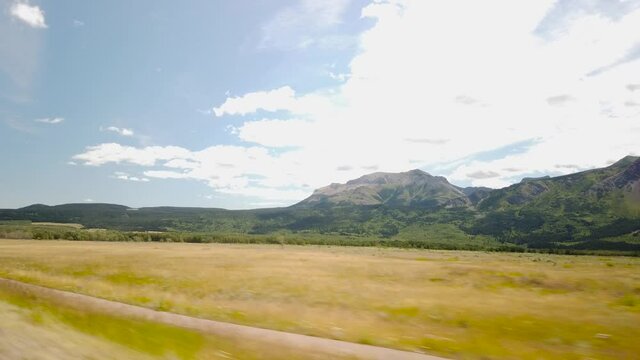 WATERTON, AB, CANADA - JULY 2019: Smooth & cinematic gimbal driving views of Waterton National Park Environment