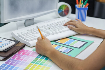 Web designers are working together to develop responsive website gear with UI UX Front End Designer...