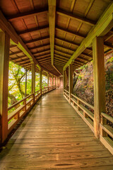 Architecture of Zen Temple Eikan-do Zenrin-ji in Higashiyama Distric, Kyoto, Japan. Wooden corridor that joins the main buildings to Tahoto Pagoda through the beautiful garden.