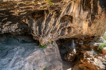 Obraz premium Karain Cave (Karain Mağarası) is a Paleolithic archaeological site located at Yağca Village 27 km. northwest of Antalya city in the Mediterranean region of Turkey.