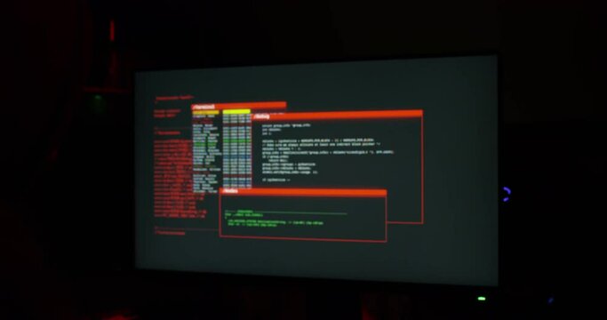 Shot of an unidentifiable hacker using a computer late at night