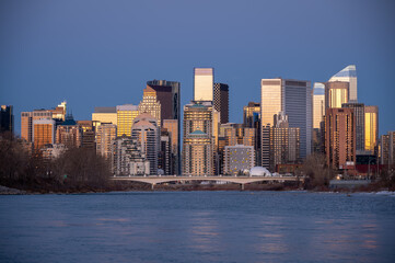 Calgary's skyline along the Bow River in the morning.