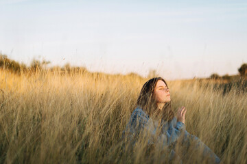 Beautiful portrait of a young stylish woman on a sunny day in autumn