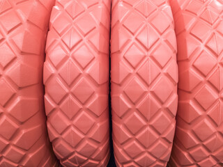 Beautiful texture pattern pink tire wheels close up.