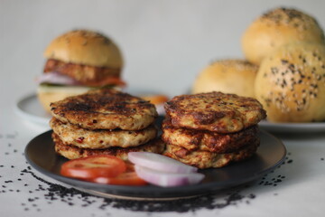 Chicken burger. Prepared by homemade chicken patty, onions, jalapeno and cheese sandwiched inside home baked burger buns