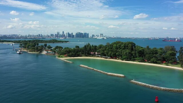 Drone shot of Kusu island with city backdrop, Singapore