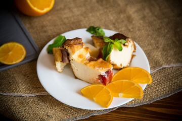 Sweet curd casserole with fruits in a plate