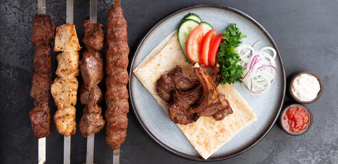 Platter of kebabs. Kebab chicken, kebab with lamb, a shish kebab of chicken
