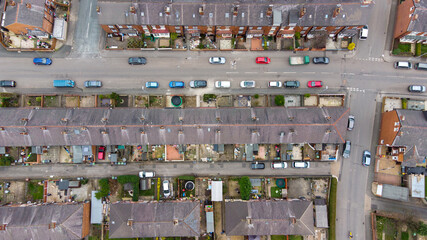 Straight down aerial photo of the British town of Beeston in Leeds West Yorkshire UK showing typical suburban terrace houses estates with rows of homes, taken in the spring time