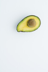 avocado on top of a white board. Empty space