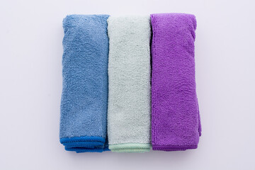 three colored microfiber cleaning cloths