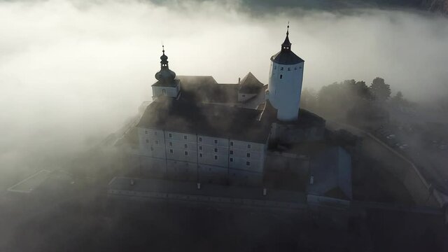 Cinematic dawn aerial drone footage of the charming historical quaint old medieval European Burg Forchtenstein Castle in Burgenland Austria