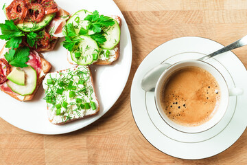 toasts slices and sandwich on a paper, wooden background