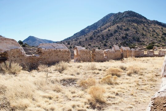 Fort Bowie National Historical Site in Arizona. Fort Bowie was a 19th-century outpost of the United States Army. Adobe ruins from the Officer's Quarters. Sun flare hits the arid climate.