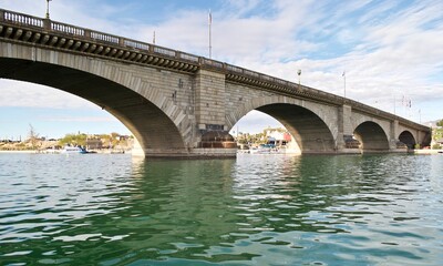 Fototapeta na wymiar London Bridge in Lake Havasu City, Arizona. It formerly spanned the River Thames in London, England. It was then purchased and reconstructed in Arizona to attract tourism and home buyers. 