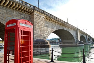 Lake Havasu City, Arizona: An iconic English red phone booth and the London Bridge. The bridge was...