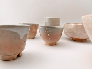 Kintsugi, Japanese broken pottery restored with gold, the beauty of being different and unique