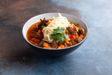 Laghman is a traditional beef noodle soup.