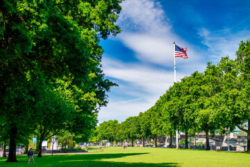 PORTLAND, OR - AUGUST 18, 2017: City park and american flag on a sunny day
