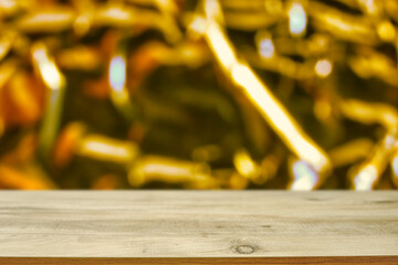 Table with empty space for business product promotion and yellow shining background behind