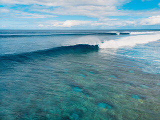 Barrel wave in tropical ocean. Aerial view of ideal surfing waves