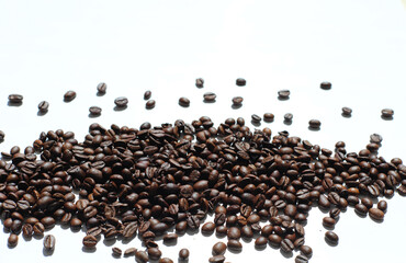Textured background with robusta and arabica coffee beans closeup. Every day, people drink aromatic strong espresso in the morning. A popular world tradition in every country. Macro view backdrop
