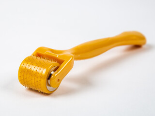 Mesoroller for the face on a white background. A tool for skin rejuvenation.