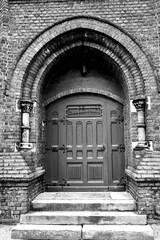 Fototapeta na wymiar Gothic portal and door to the Evangelical church
