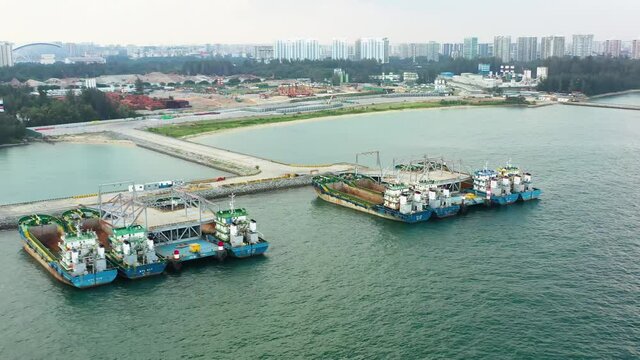 Drone shot of empty cargo ships moored, Singapore